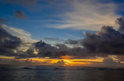 Scenic view of sea against sky at sunrise