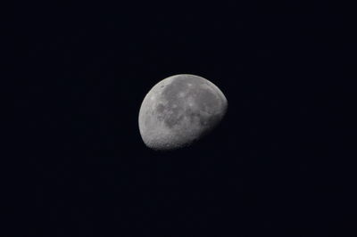 Low angle view of moon against clear sky at night