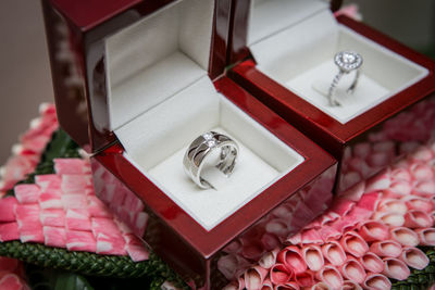 High angle view of wedding rings in box