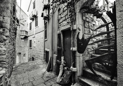 Alley amidst buildings in city