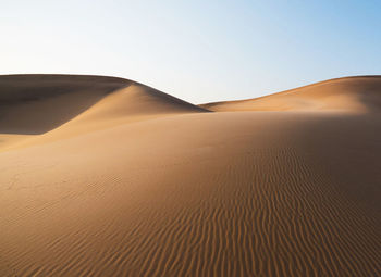 Scenic view of desert against clear sky