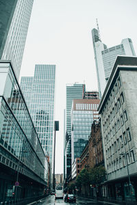 Buildings in city against clear sky