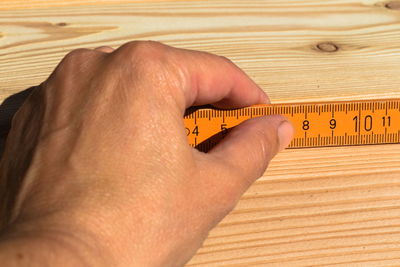 Close-up of human hand on table