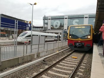 Train at railroad station against sky