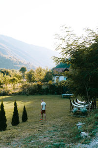 Rear view of man walking in park