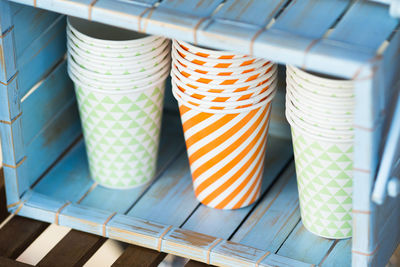 Multi colored disposable cups on table