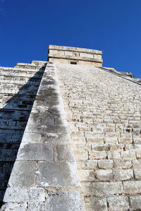 Low angle view of historical building against blue sky