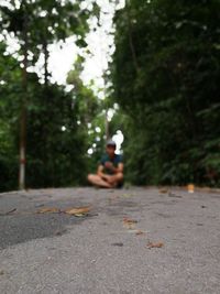 Man sitting on road