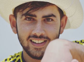 Close-up portrait of smiling young man