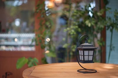 Close-up of lamp placed on table