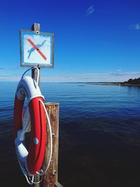 Scenic view of sea against blue sky