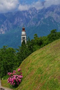 Scenic view of building and mountains against sky