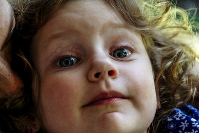 Close-up portrait of cute girl outdoors