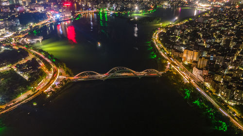 High angle view of illuminated buildings in city at night