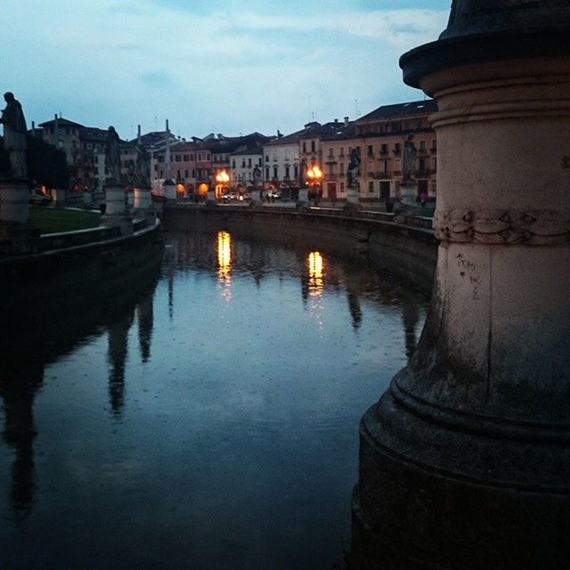 architecture, built structure, building exterior, water, reflection, river, waterfront, canal, city, sky, bridge - man made structure, connection, arch, building, residential structure, transportation, residential building, arch bridge, outdoors, travel destinations