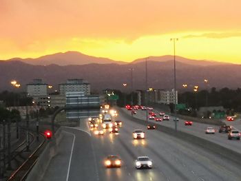 High angle view of traffic on road at sunset