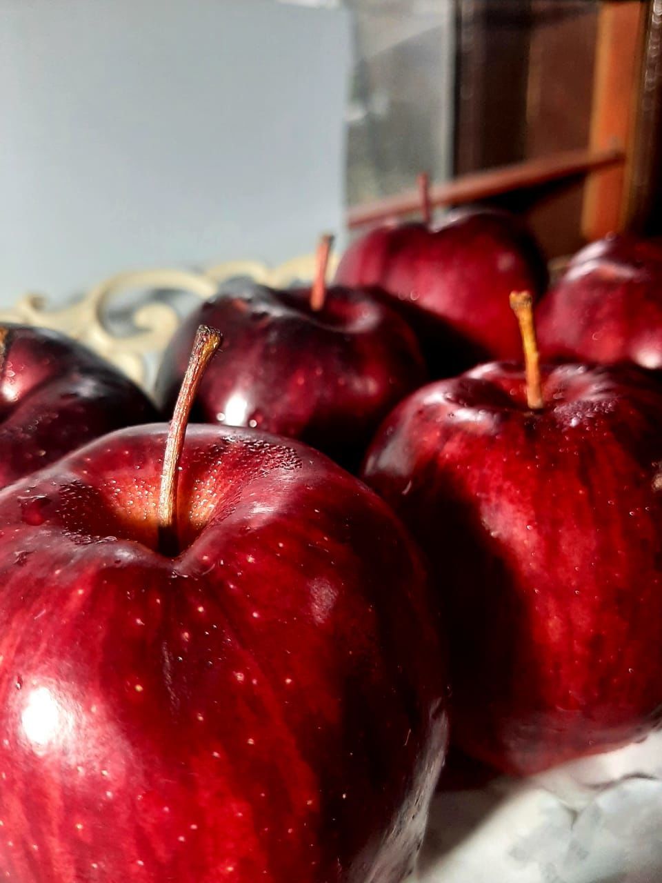 CLOSE-UP OF APPLES IN CONTAINER