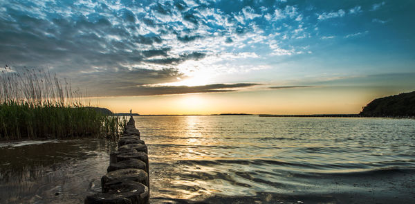 Scenic view of sea against sky during sunset