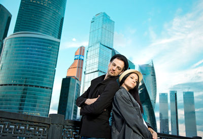 Couple in love on the background of city buildings