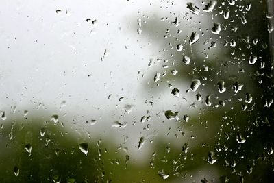 Close-up of wet window in rainy season