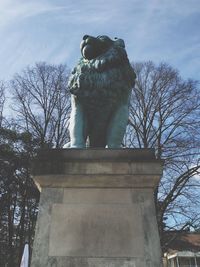 Low angle view of statue against sky