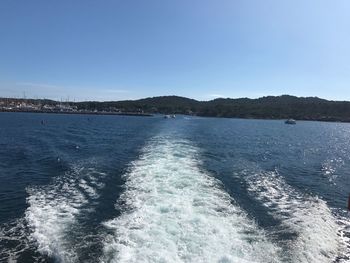 Scenic view of sea against clear blue sky