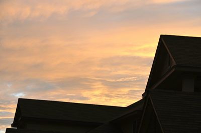 Low angle view of house against sky during sunset