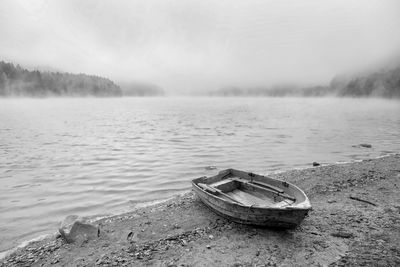 Boat moored on shore