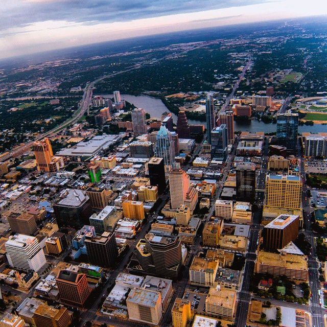 building exterior, architecture, cityscape, city, built structure, crowded, high angle view, residential district, aerial view, sky, residential structure, residential building, skyscraper, roof, modern, city life, tower, office building, outdoors, day