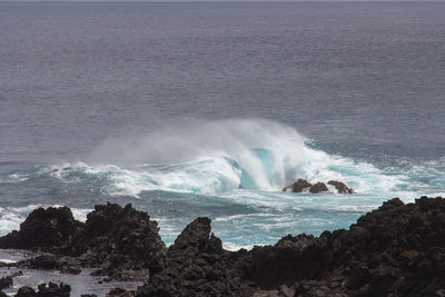 Waves splashing on rocks at shore