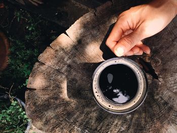 Close-up of hand holding coffee cup