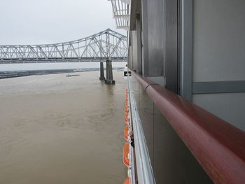 Suspension bridge over river seen through boat