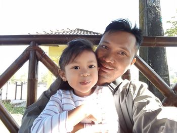 Portrait of happy mother and daughter outdoors