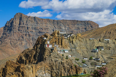 Panoramic view of town against cloudy sky