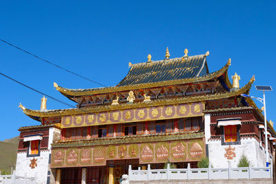 Low angle view of building against blue sky