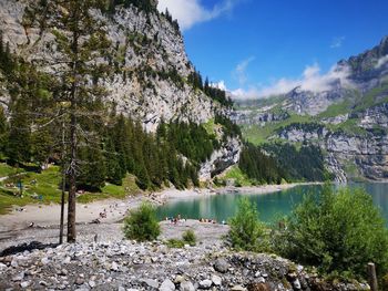 Scenic view of lake and trees against sky