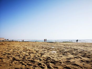 Scenic view of beach against clear sky