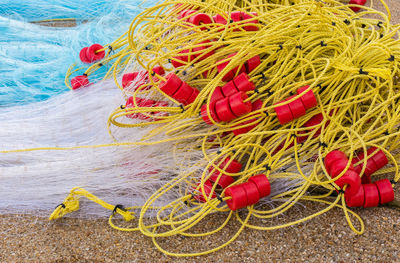 High angle view of fishing nets on sand