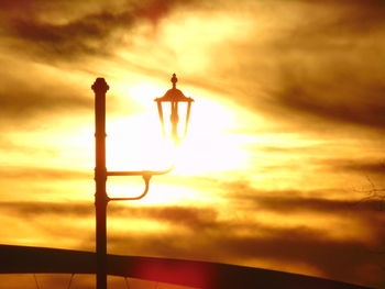 Low angle view of street light against sky