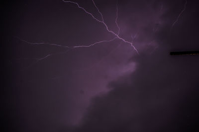 Low angle view of lightning in sky at night