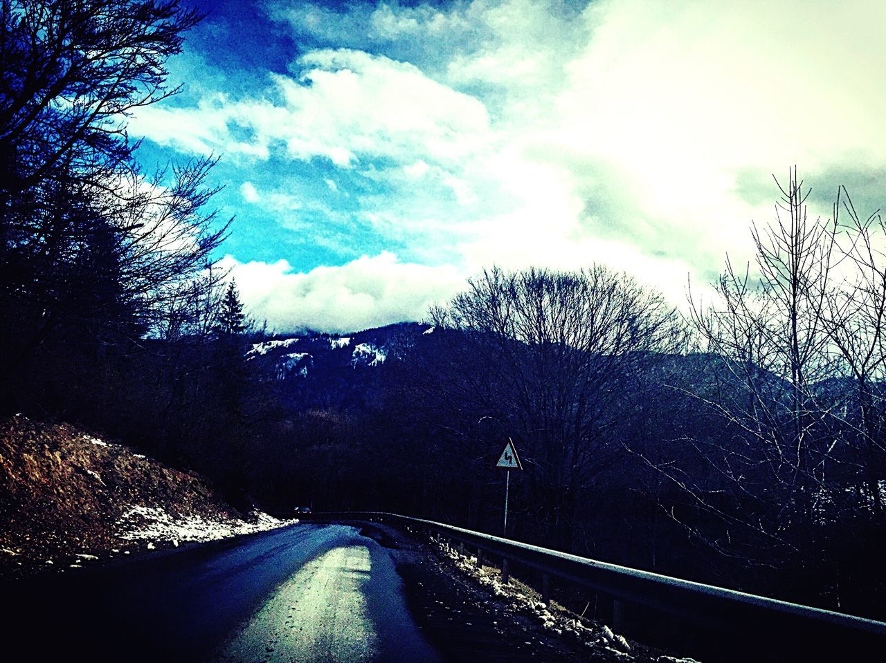 sky, tree, cloud - sky, transportation, road, bare tree, the way forward, cloud, cloudy, mountain, tranquility, nature, tranquil scene, scenics, silhouette, car, landscape, diminishing perspective, beauty in nature, weather