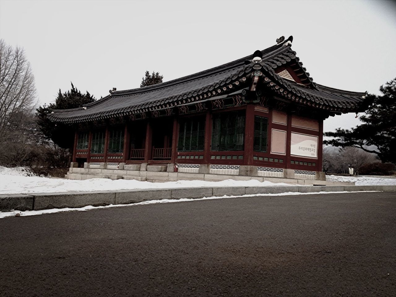 architecture, built structure, building exterior, place of worship, religion, spirituality, clear sky, facade, temple - building, history, entrance, exterior, tree, architectural column, famous place, travel destinations, sky, outdoors, day, temple