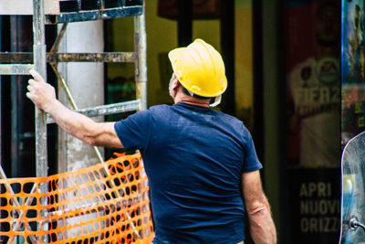 Rear view of man working