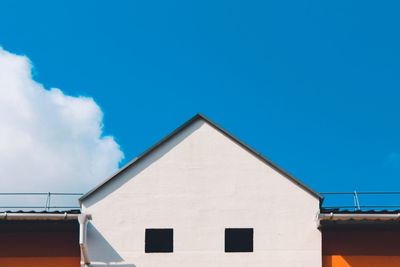 Low angle view of building against blue sky