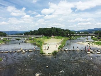 High angle view of people at beach against sky