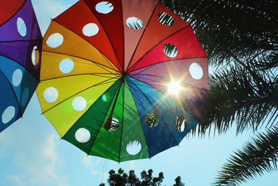 Low angle view of umbrella against sky