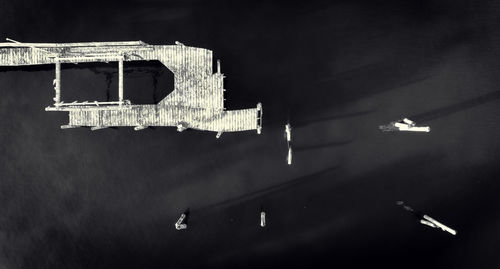 Close-up of illuminated lamp in city at night