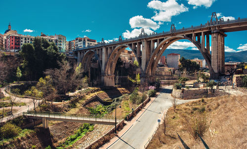 San jordi bridge over road in city