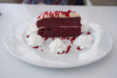 Delicious red velvet cake served on plate in restaurant