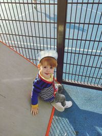 High angle view of cute boy standing on street